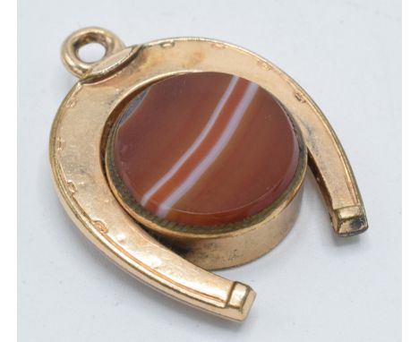 Gold plated horseshoe watch fob with agate face and compass, 3.5cm long.  