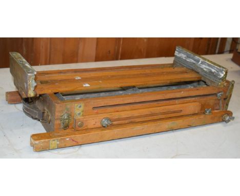 Vintage folding wooden artists easel with metal tray, with remains of paint and work.  