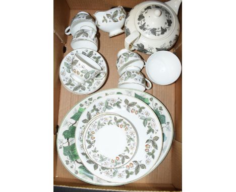 Wedgwood tea and dinner ware in the 'Napoleon Ivy' pattern and similar to include a teapot, cups and saucers, a platter and o