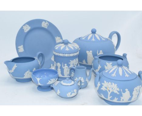 Wedgwood Jasperware in Blue: to include a teapot,milk, lidded sugars, trinket and miniatures .  Condition is generally good a