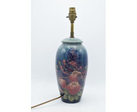 Large Moorcroft lamp base in Finch and Berry pattern, 26.5cm tall exc. brass fittings.  In good condition with no obvious dam