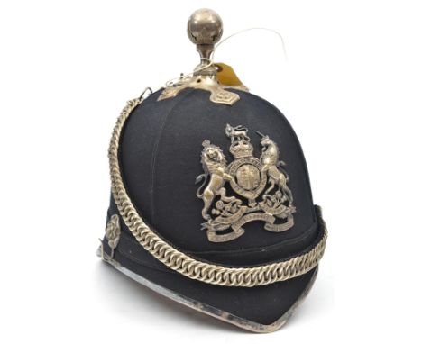 A post 1902 officer’s blue cloth ball topped helmet of the R. Army Medical Corps, gilt HP, top mount, velvet backed chinchain