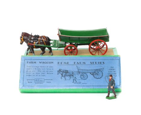A Britains Home Farm Series Farm Waggon (5F). An example in dark green with red wheels and enhancements, complete with correc