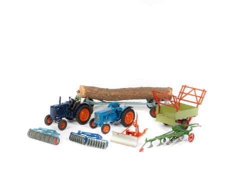 Britains Farm toys. A  Fordson Major Tractor - with rubber tyres. In dark blue with orange wheels and black treaded rubber ty