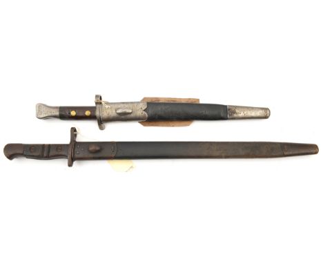 A P1888 Mk I, second type bayonet,  by Wilkinson, oil hole in grip, 2 brass rivets; and a P1913 bayonet by Remington; in stee