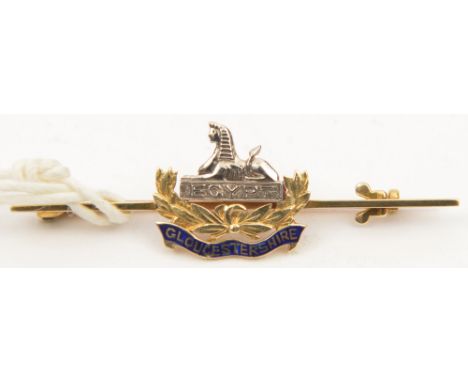 A WWI period enamelled “15 ct” tie pin brooch of The Gloucestershire Regt. VGC                   