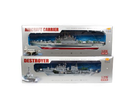 2 x Heng Tai battery powered radio controlled model ships. 1/275 scale plastic models, both well detailed, an Aircraft Carrie