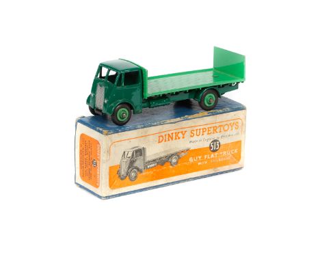 Dinky Supertoys Guy Flat Truck with tailboard (513). An example with dark green cab, chassis and wings, with mid green rear b