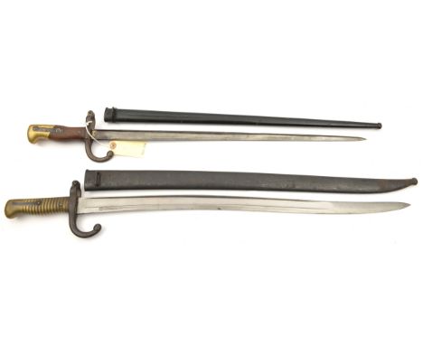 A Chassepot bayonet, “St Etienne 8bre 1871” on backstrap, in scabbard, matching nos 94116 (blade good, light rust to guard an