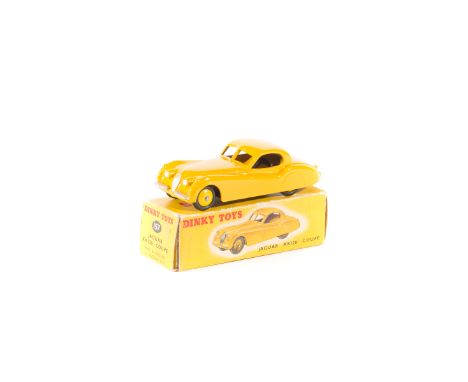 Dinky Toys Jaguar XK120 Coupe (157). In deep yellow with lighter yellow wheels and black rubber tyres. Boxed, with correct co