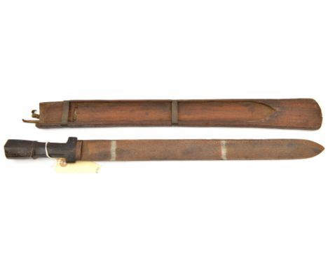 A Bhotan shortsword,  flat SE blade 15½”, slightly flattened octagonal section darkwood grip, with central ridge, in its open