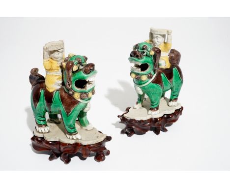 A pair of Chinese verte biscuit joss stick holders shaped as warriors on Buddhist lions, Kangxi Dim.: 11 x 10 x 4,5 cm (excl.