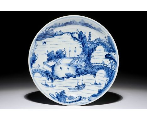 A fine Chinese blue and white landscape plate, Kangxi Dia.: 23,7 cm - H.: 4,2 cm  Condition: (UV checked)- With a 3 cm hairli