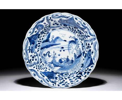 A Chinese blue and white dish with carps on the rim, Kangxi Dia.: 28 cm