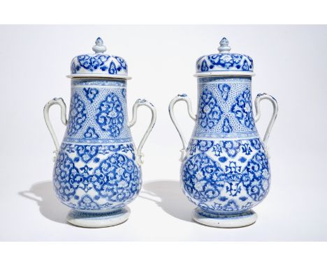 A pair of Chinese blue and white covered urns, Kangxi H.: 33 cm  Provenance:- With an inventory number for the Princessehof M
