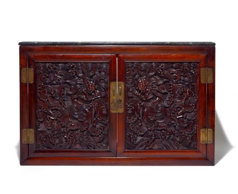 A Chinese two doors cabinet in hongmu and huanghuali with zitan dragon panels, 18/19th C. Dim.: 63 x 99 x 44 cm  Provenance: 