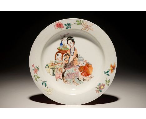 A Chinese famille rose ruby back eggshell plate with a lady and playing boys, Yongzheng Dia.: 21 cm
