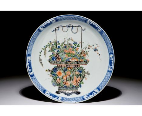 A Chinese famille verte dish with a flower basket, Kangxi Dia.: 35 cm