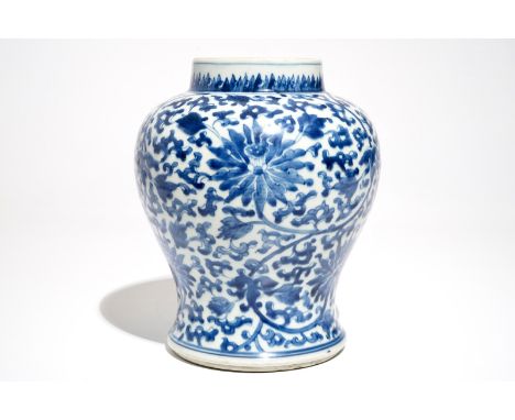 A Chinese blue and white vase with lotus scrolls, Kangxi H.: 26 cm