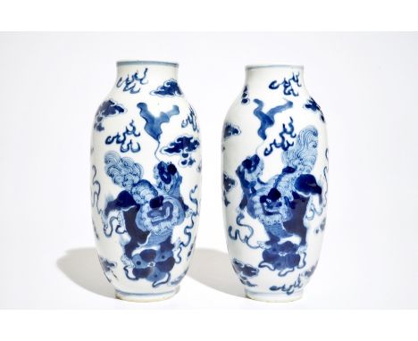 A pair of Chinese blue and white vases with Buddhist lions, Kangxi mark, 19th C. H.: 18,5 cm