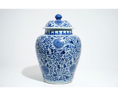 A tall Chinese blue and white baluster jar and cover with lotus scrolls, Kangxi H.: 52 cm