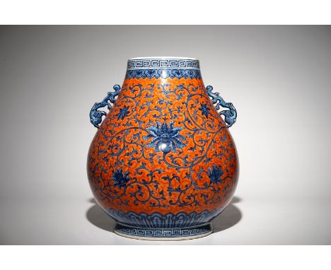 A Chinese coral-ground peony scroll hu vase, Yongzheng mark, 20th C. H.: 43 cm