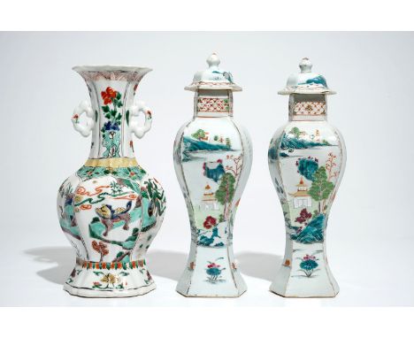  A Chinese famille verte vase with animals, Kangxi, with a pair of famille rose vases and covers, Qianlong H.: 31 cm (the tal