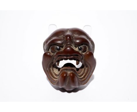 A Japanese carved boxwood netsuke of a devil's or demon's head, Edo/Meiji, 18/19th C. Dim.: 5,5 x 4,5 x 3,5 cm