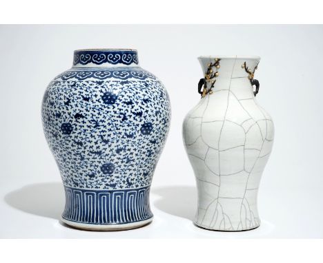 A Chinese crackle-glazed vase and a blue and white lotus scroll baluster jar, 19th C. H.: 35,5 cm (the tallest)