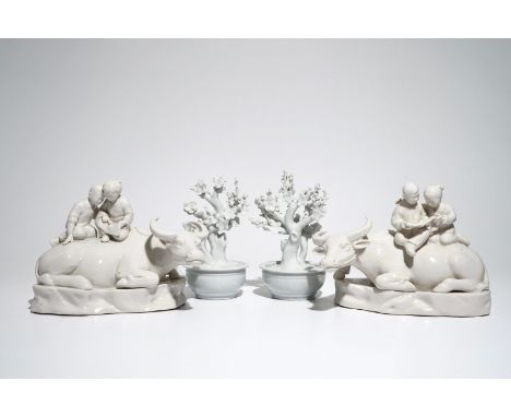  A pair of Chinese Dehua blanc de Chine prunus trees, Kangxi, and a pair of water buffalos with children, 20th C. Dim.: 18 x 