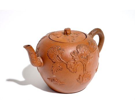 A Chinese Yixing stoneware teapot and cover with applied decoration, Kangxi H.: 9 cm