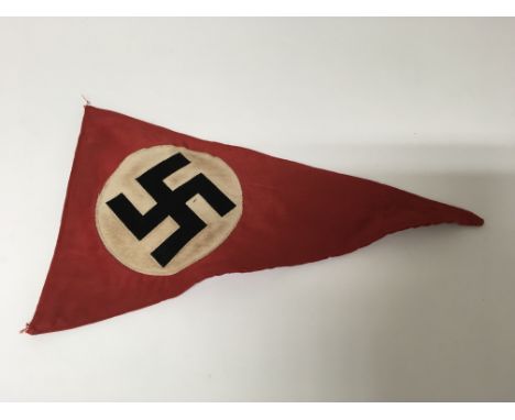 A German WW2 pennant flag, bearing a swastika patch to either side. No mounting points.