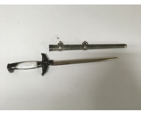 A retrospective copy of a German WW2 Nazi dagger with scabbard.