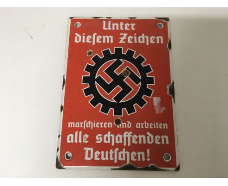 A small German WW2 enamel plaque bearing the DAF swastika. Size approx 17cm.