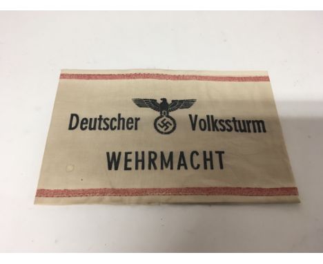 A German WW2 style Deutschland Volkssturm Wehrmacht armband for the German Homeguard attached to the army.