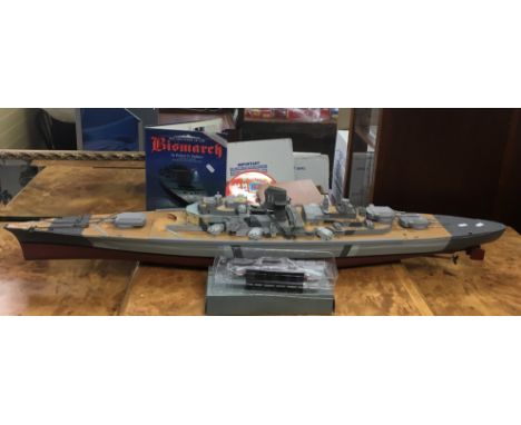 A remote control model of a WWII boat, possibly The Bismarck.Approx 126cm long, lacking remote control