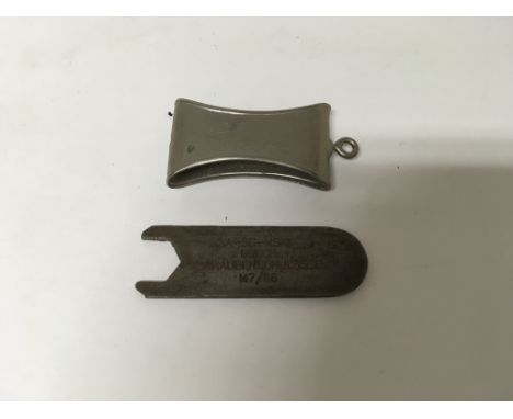 A German SS, SA or NSKK dagger scabbard fitmemt piece and a spanner for the top nut of a dagger.