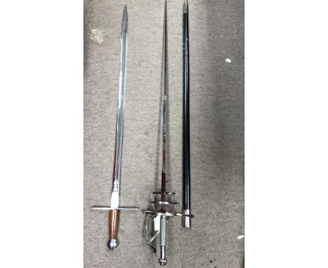 A modern commemorative sword by Wilkinson and a swept hilt Rapier sword.