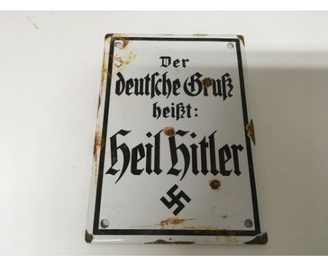 A German WW2 small enamel “Heil Hitler” plaque. Size approx 17cm by 12cm.