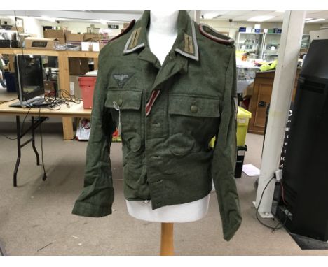 A German army panzer battledress. S?derbergs Uppsala label. Small fitment.