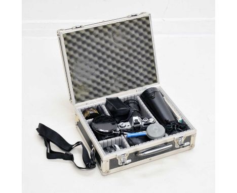 Canon AE-1 camera with Canon Zoom Lens FD 35-105mm, together with a quantity of accessories to include; 'Blower Brush', Canon