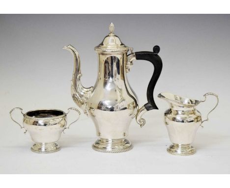 Elizabeth II silver three piece coffee set comprising coffee pot, sugar bowl, and cream jug, sponsor's mark of Mappin &amp; W