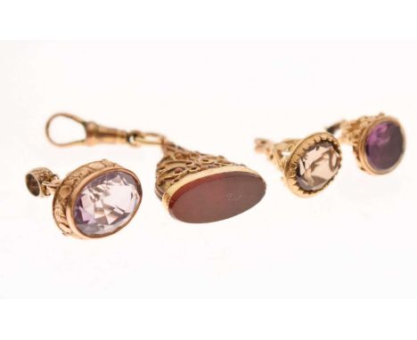 Group of four fob seals, including a 9ct gold smokey quartz fob, a 9ct gold amethyst fob, and two unmarked yellow metal examp