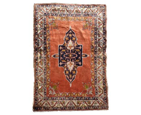 Indian silk rug, with Central Persian design, mid 20th century, the brick red field having a large central indigo ground cart