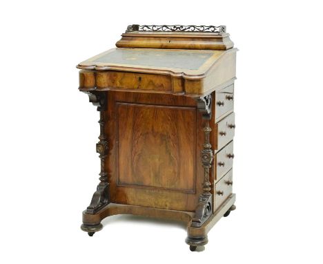Victorian walnut Davenport, pierced gallery hinged top, over green inset leatherette writing slope, and bank of four drawers 