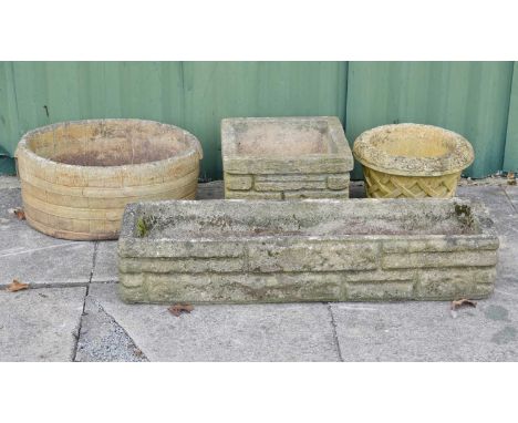 Three composition stone planters, together with a brick effect composition stone trough, 91cm wide and smaller (4)