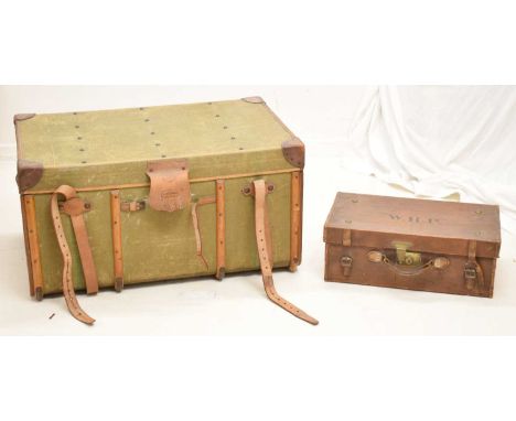 Early 20th century green canvas trunk, retailed by Finnigans of Manchester and stamped to the leather lockplate cover, studde