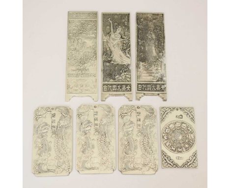 Seven Chinese scroll weights, each with stamped marks to the reverse, 15cm high and smaller