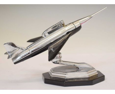 Vintage novelty Gala-Sonic fighter jet table lighter, on octagonal step base, mounted on black plastic, 14cm high 