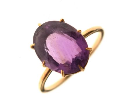 Amethyst dress ring, the faceted oval stone 11mm x 14mm approx, the yellow metal shank indistinctly stamped '18c', size T½, 4